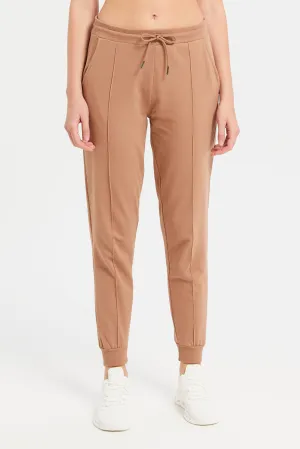 Women Rust Solid Jogger Pants With Pockets